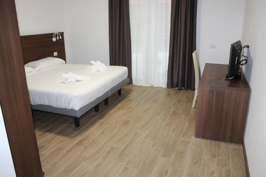 Postel nebo postele na pokoji v ubytování Hotel Bocciolo