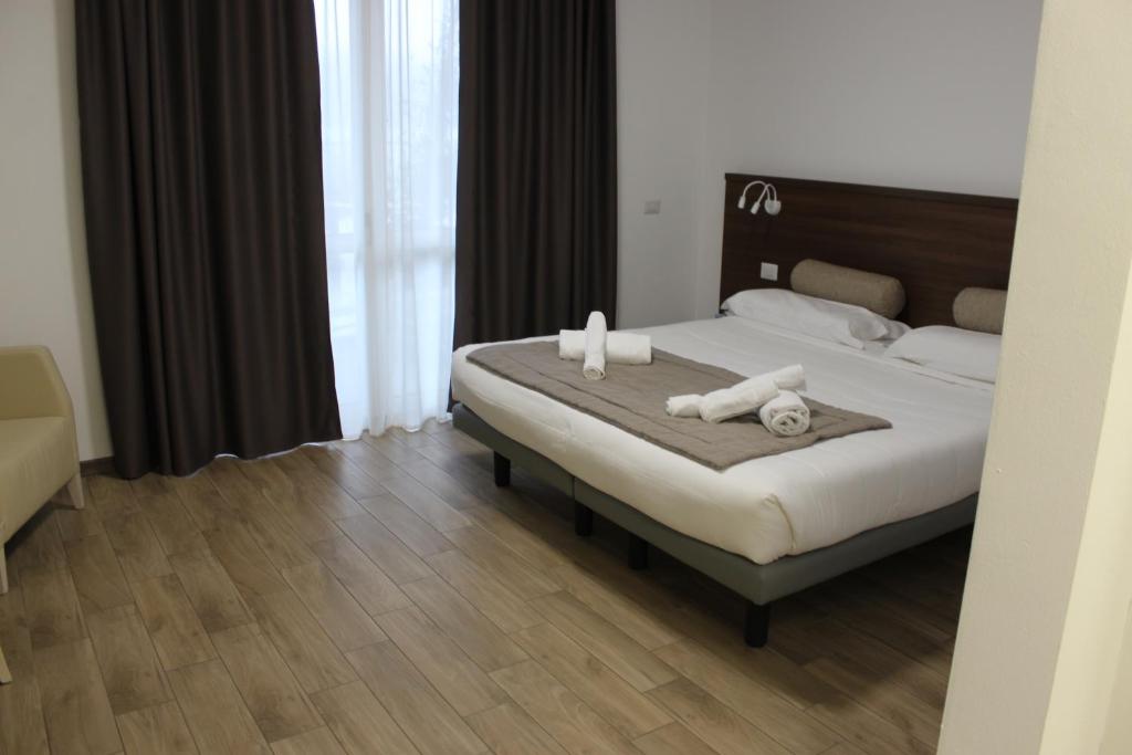 Postel nebo postele na pokoji v ubytování Hotel Bocciolo