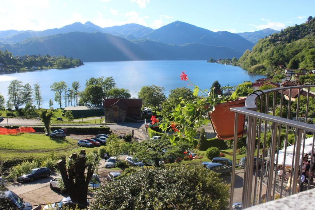 a view of a lake from a balcony at Hotel Bocciolo in Orta San Giulio