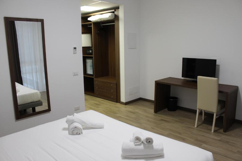 Postel nebo postele na pokoji v ubytování Hotel Bocciolo