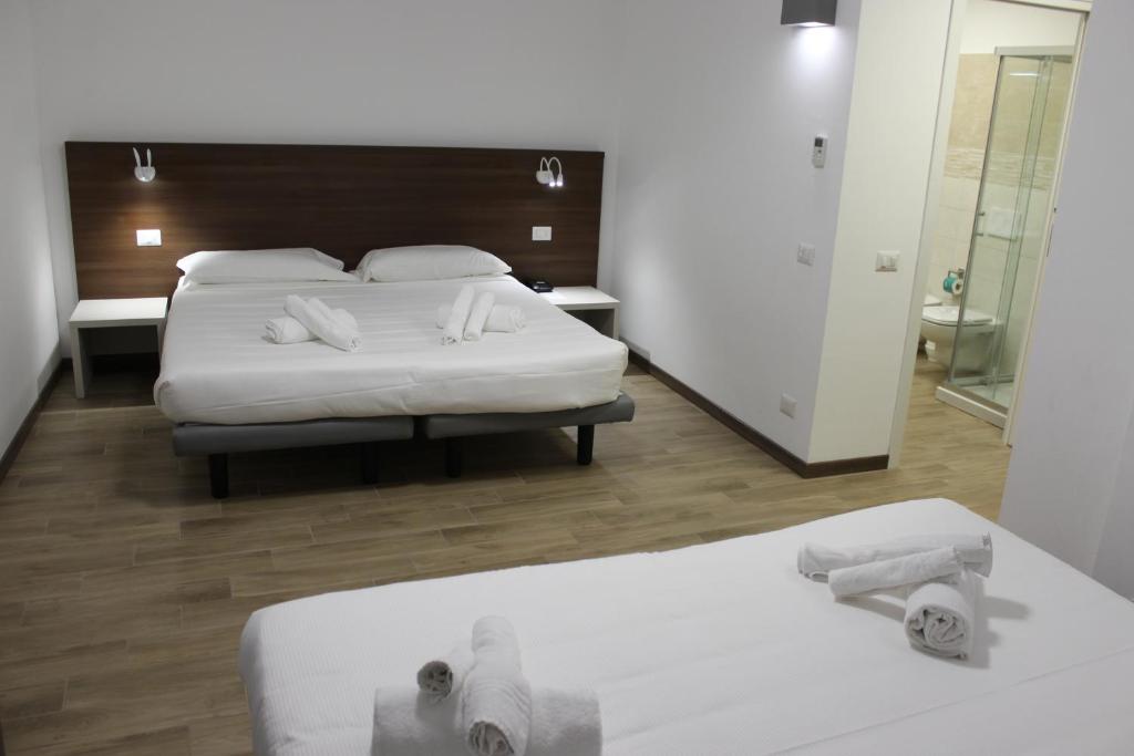 Postel nebo postele na pokoji v ubytování Hotel Bocciolo