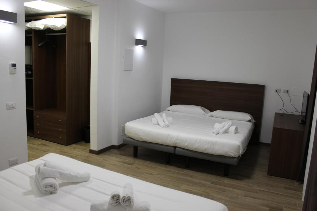 Postel nebo postele na pokoji v ubytování Hotel Bocciolo
