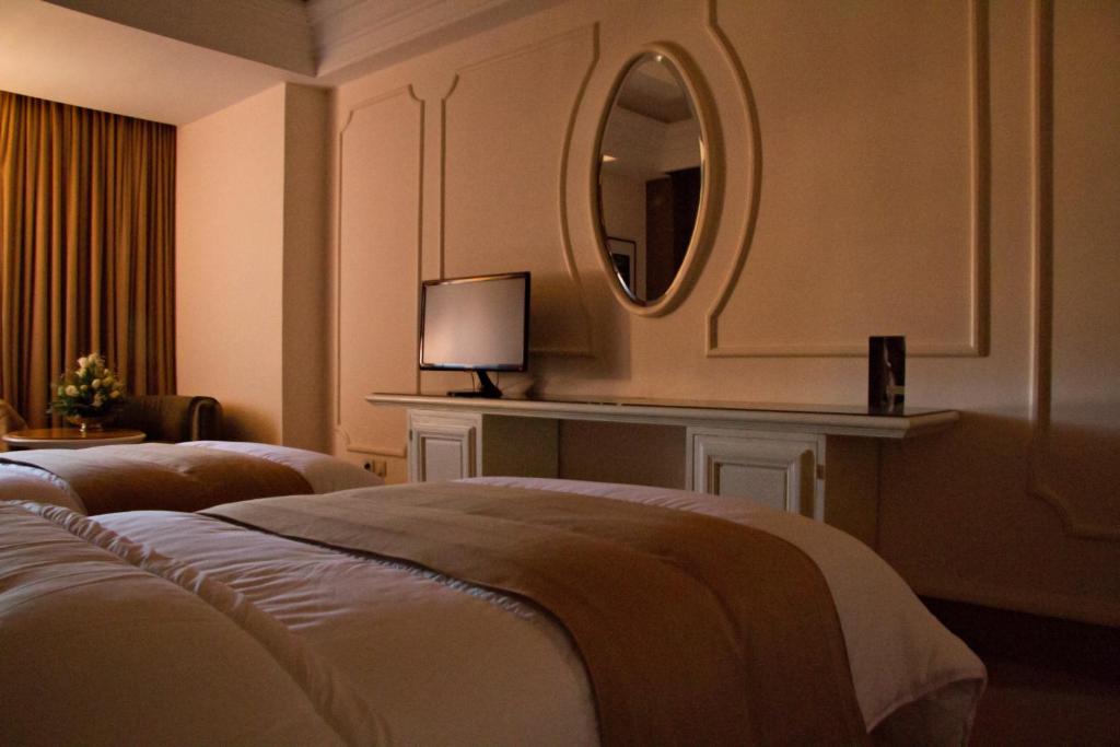 Postel nebo postele na pokoji v ubytování Nassim Hôtel