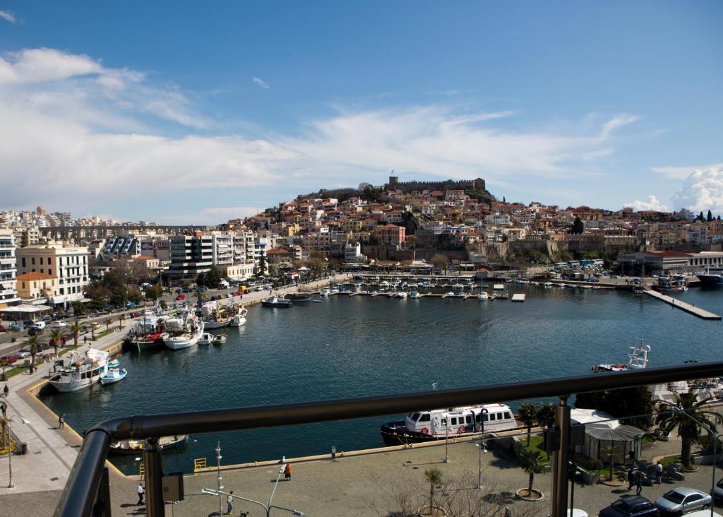 a view of a harbor with boats in the water at Panorama Junior Suites in Kavala