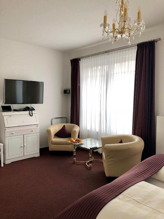 TV a/nebo společenská místnost v ubytování Hotel Sylter Blaumuschel
