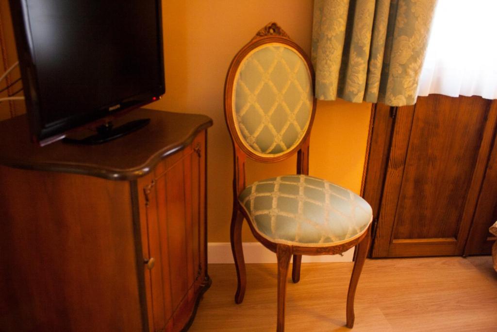 TV a/nebo společenská místnost v ubytování Hotel Locanda Canal