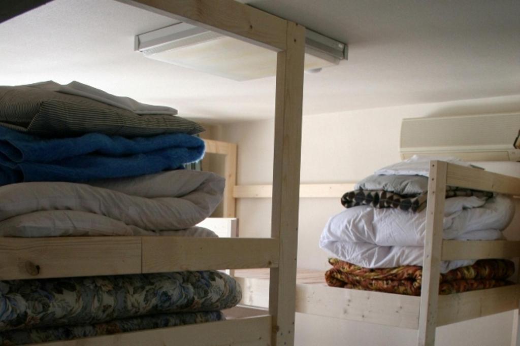 Postel nebo postele na pokoji v ubytování Travellersdou Kirinya