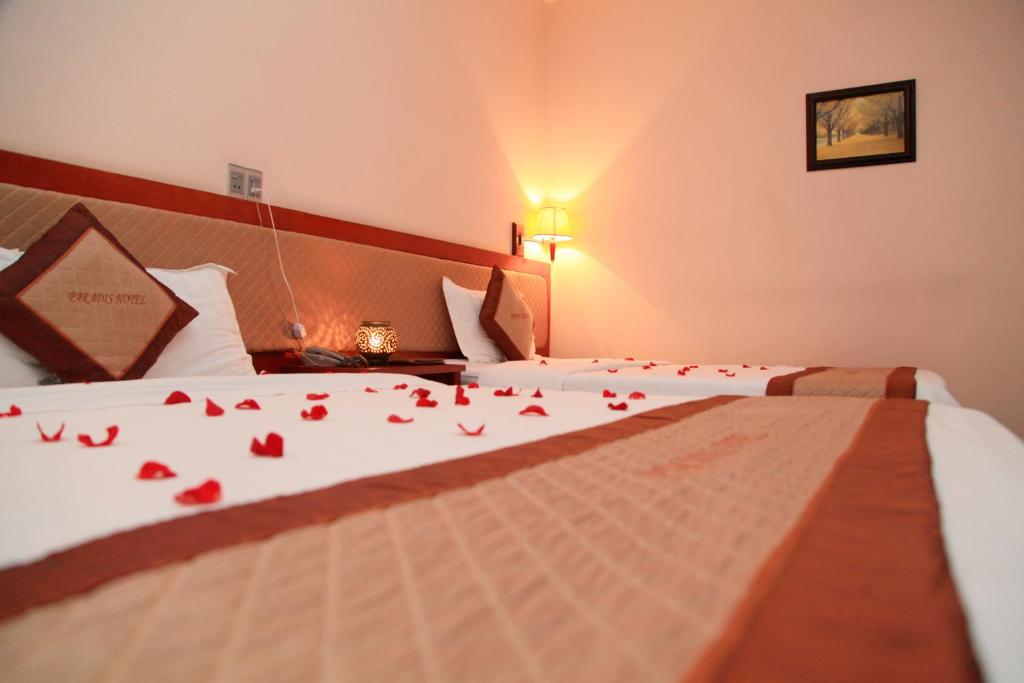 Postel nebo postele na pokoji v ubytování Paradis Hotel