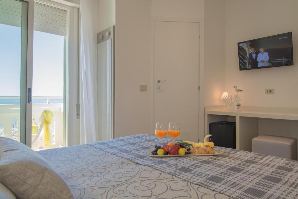 Postel nebo postele na pokoji v ubytování Hotel Montecarlo 3 Stelle Superior
