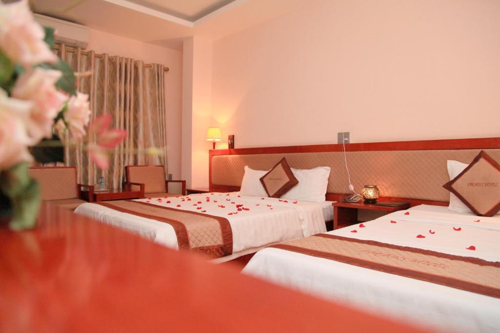 Кровать или кровати в номере Paradis Hotel