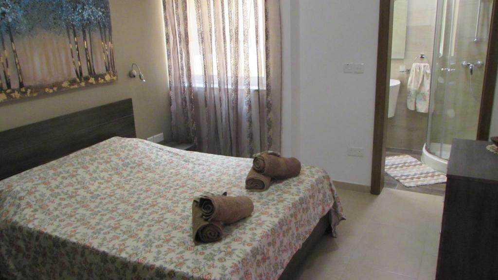 Cama o camas de una habitación en Carina Court Apartment