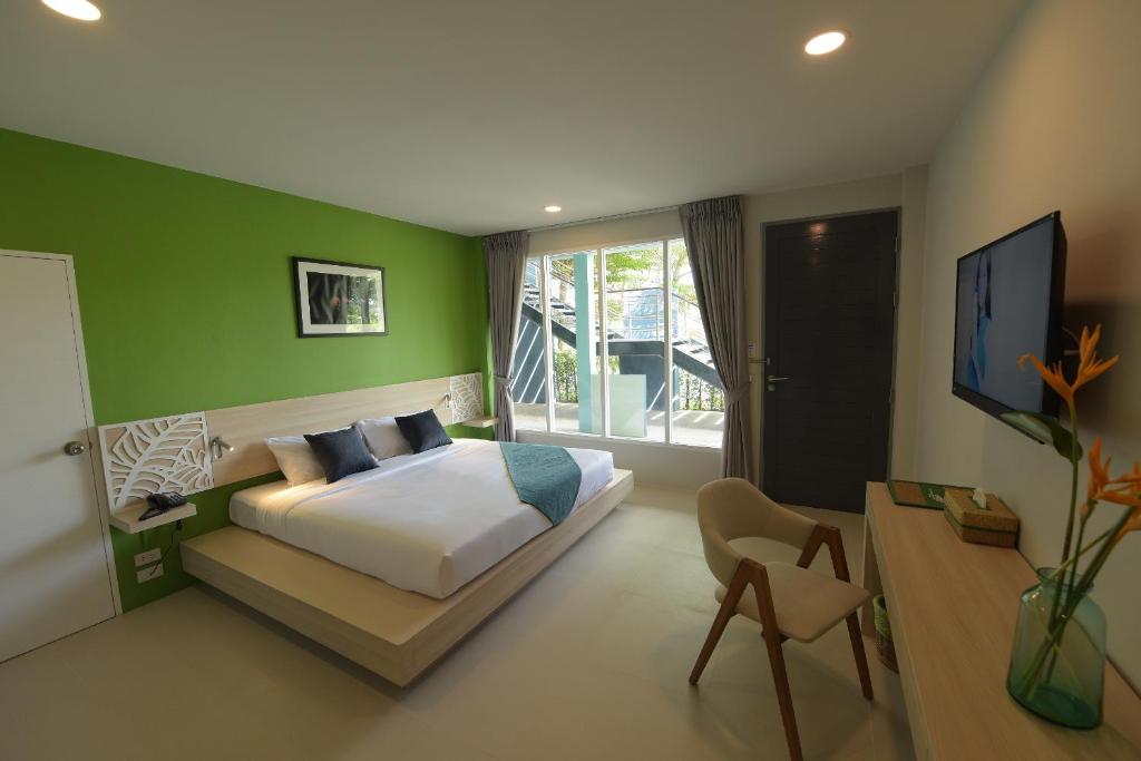 Postel nebo postele na pokoji v ubytování The Touch Green Naiyang Hotel & Fitness
