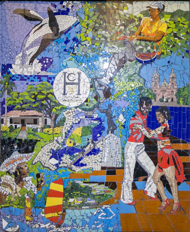 a mosaic mural of a man playing a game at Hotel Casa Vallecaucana in Cali