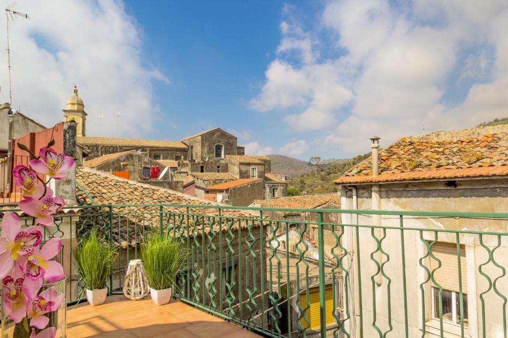 a balcony with a view of a city at Casa La Scala in Linguaglossa