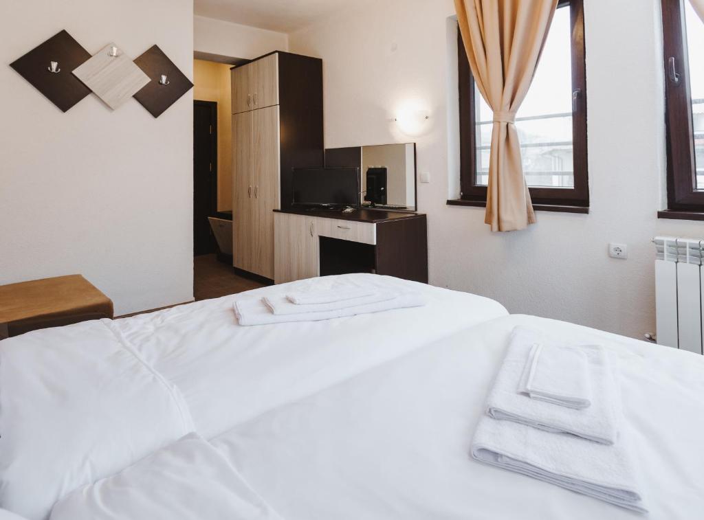 Postel nebo postele na pokoji v ubytování Zlatograd 2 Iosifova Guest House