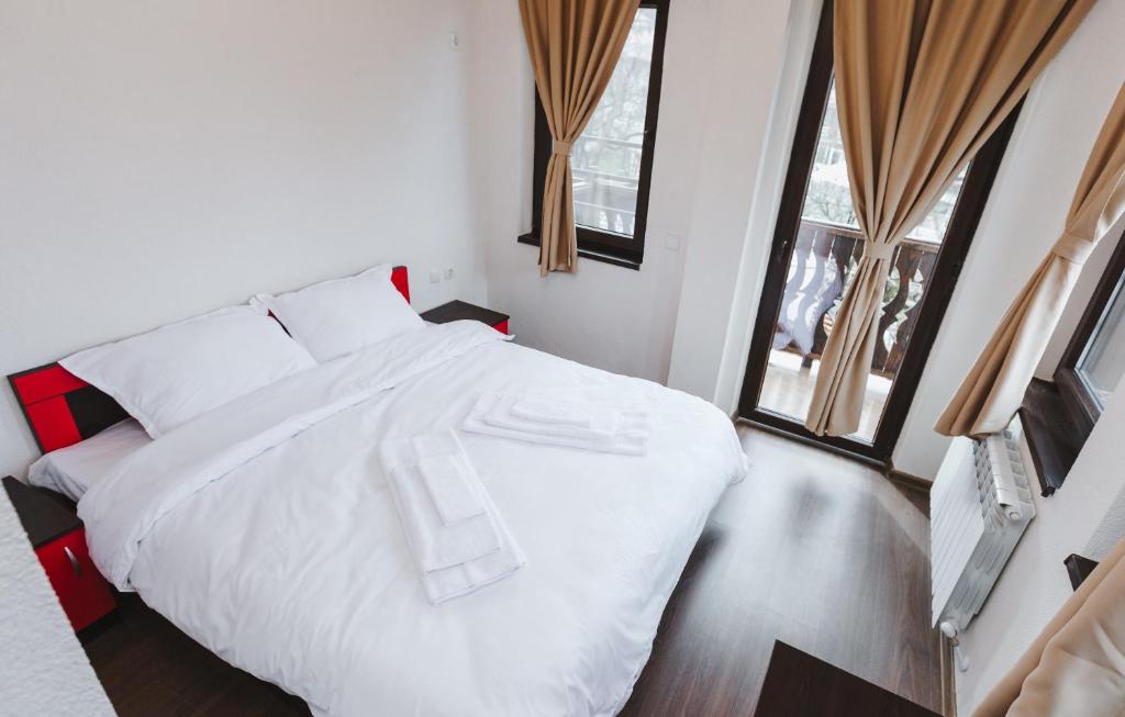 Postel nebo postele na pokoji v ubytování Zlatograd 2 Iosifova Guest House