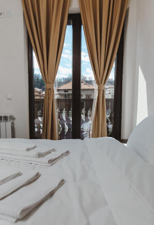 Postel nebo postele na pokoji v ubytování Zlatograd 2 Iosifova Guest House