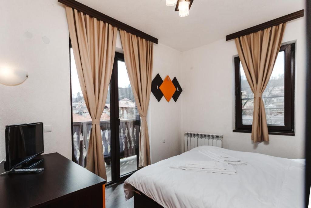 Postel nebo postele na pokoji v ubytování Zlatograd 2 Iosifova Guest House