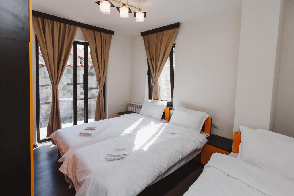 Postel nebo postele na pokoji v ubytování Zlatograd 2 Iosifova Guest House