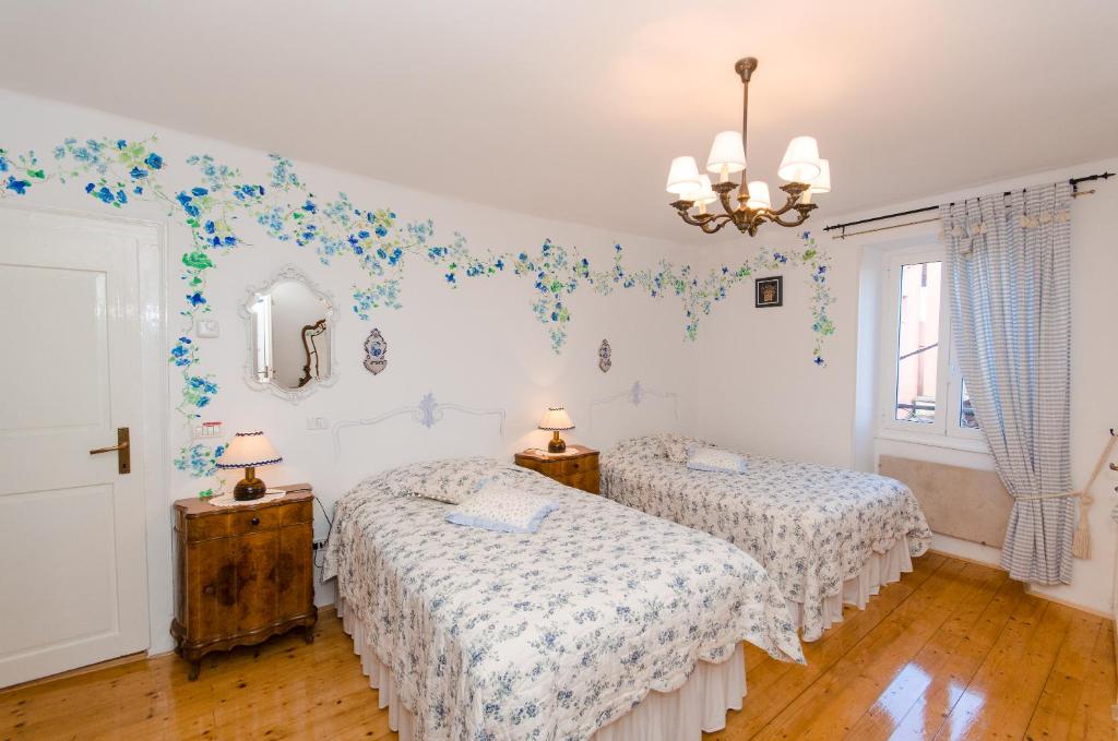 Postel nebo postele na pokoji v ubytování Casa Paola