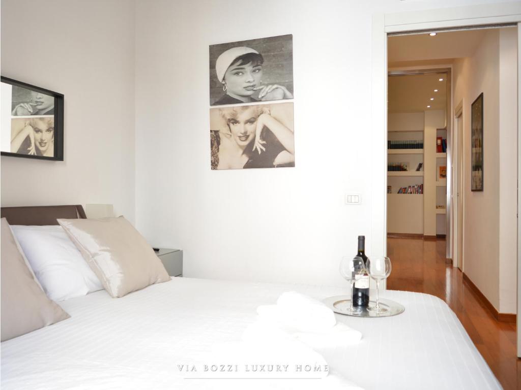 Łóżko lub łóżka w pokoju w obiekcie Via Bozzi Luxury Home