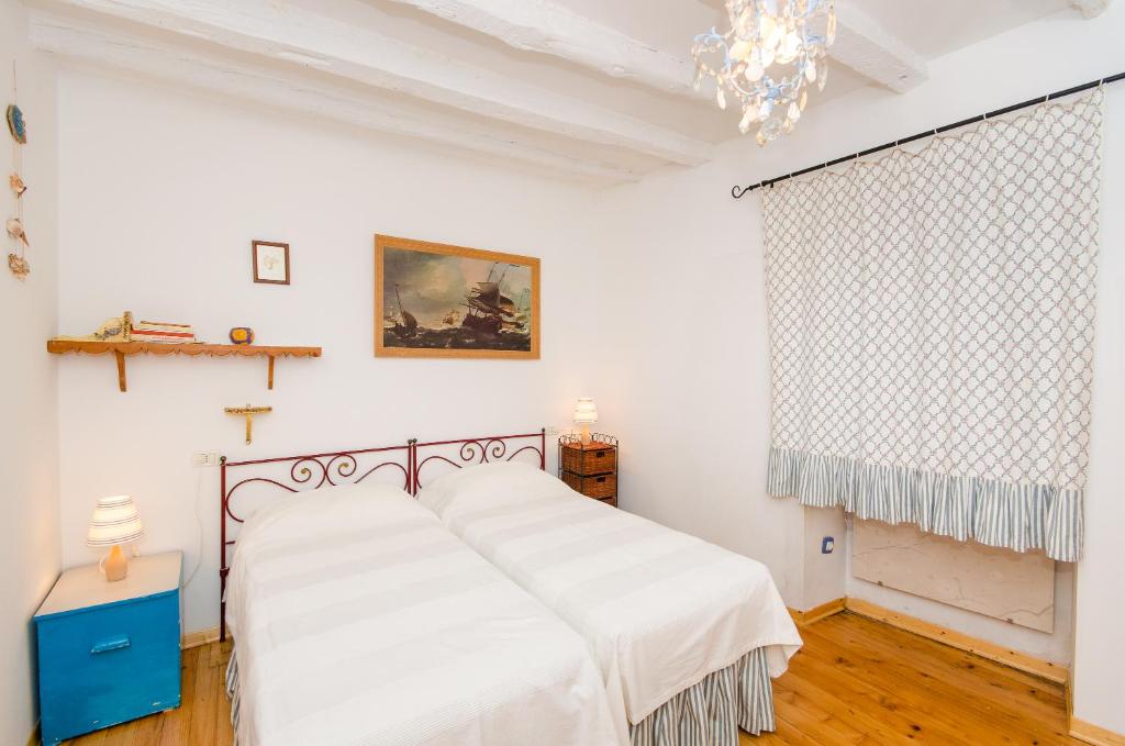Postel nebo postele na pokoji v ubytování Casa Paola