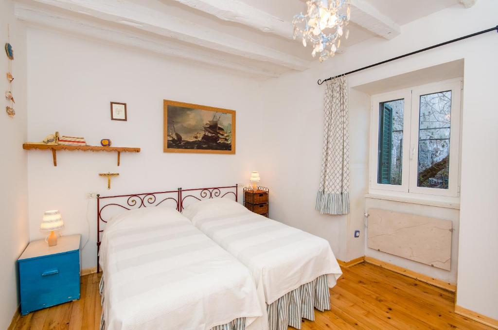 Postel nebo postele na pokoji v ubytování Casa Paola