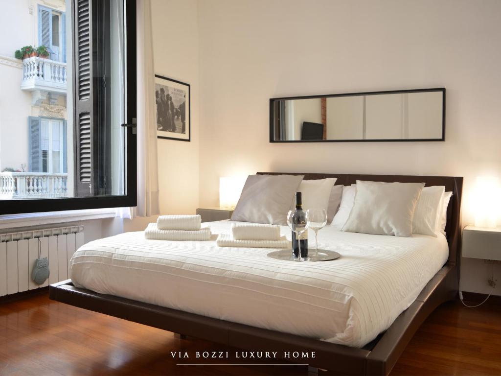 Łóżko lub łóżka w pokoju w obiekcie Via Bozzi Luxury Home