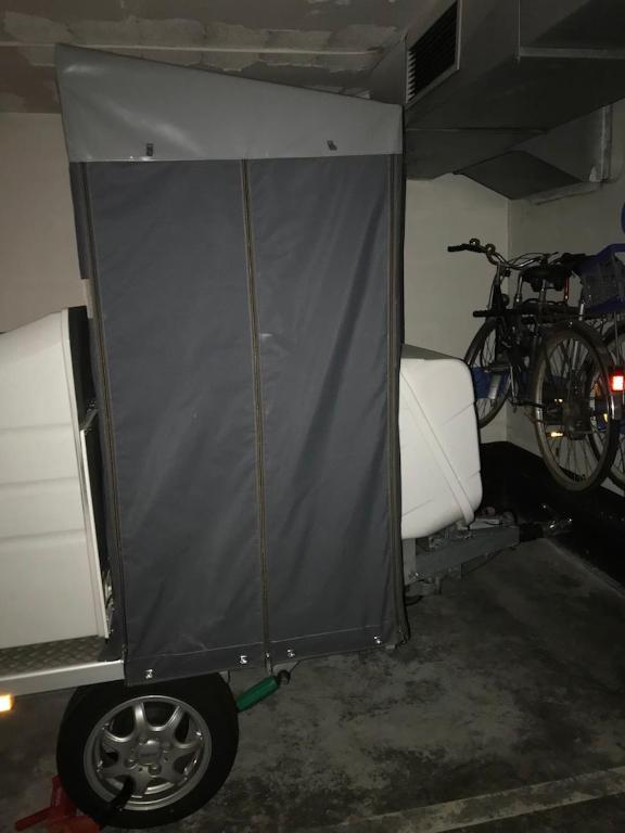 a tent in a garage with a bike in it at Cala Azul 304-306 Tamarit in Tamarit