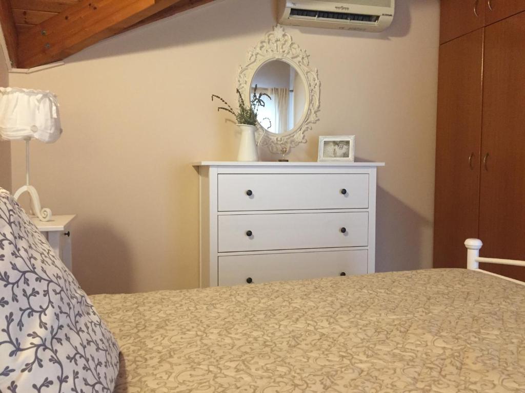 Postel nebo postele na pokoji v ubytování Helianthus Apartments