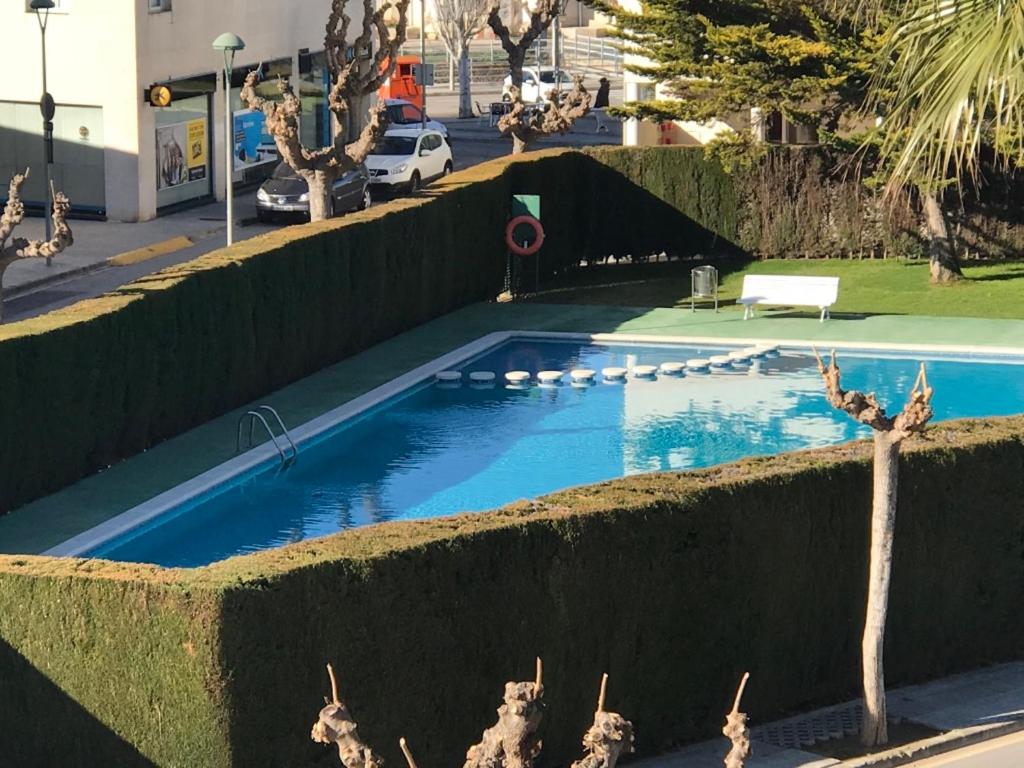 a swimming pool in the middle of a street at Cala Azul 304-306 Tamarit in Tamarit