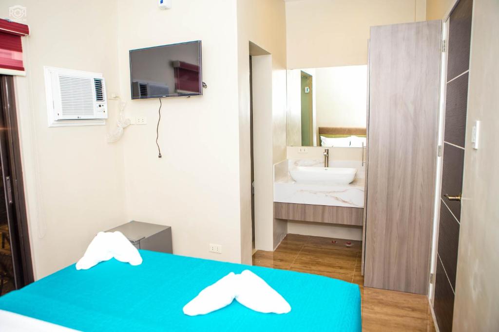 Postel nebo postele na pokoji v ubytování Propicio Hotel and Resort