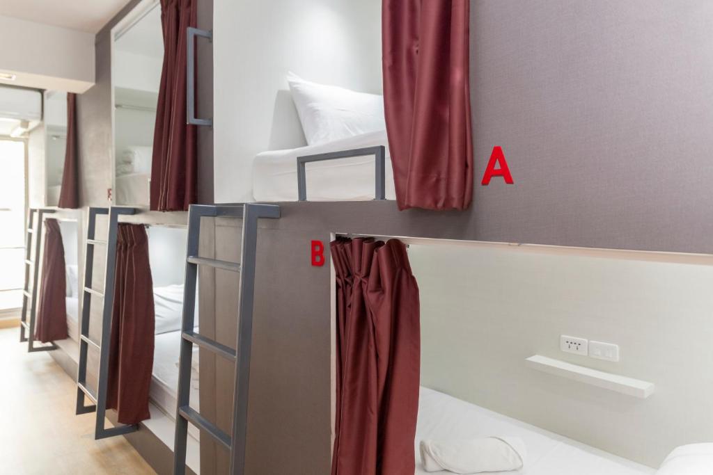 Postel nebo postele na pokoji v ubytování ALEXA Nimman