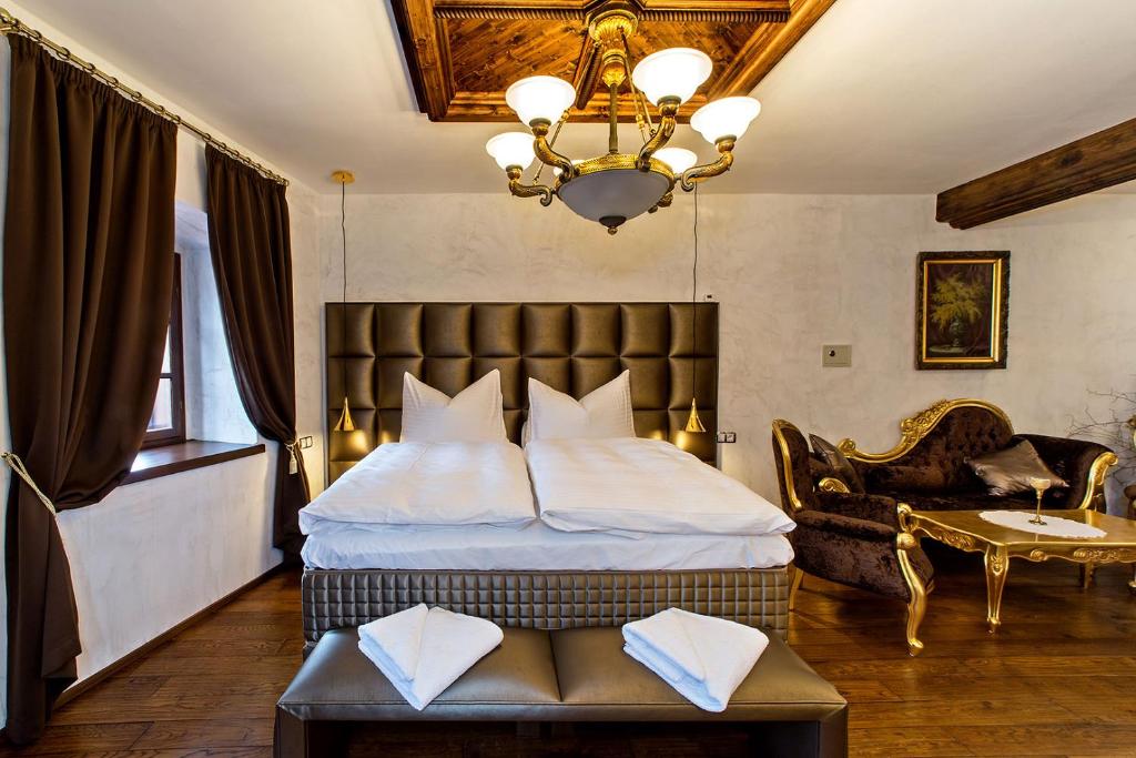 Llit o llits en una habitació de Arcadie Hotel & Apartments