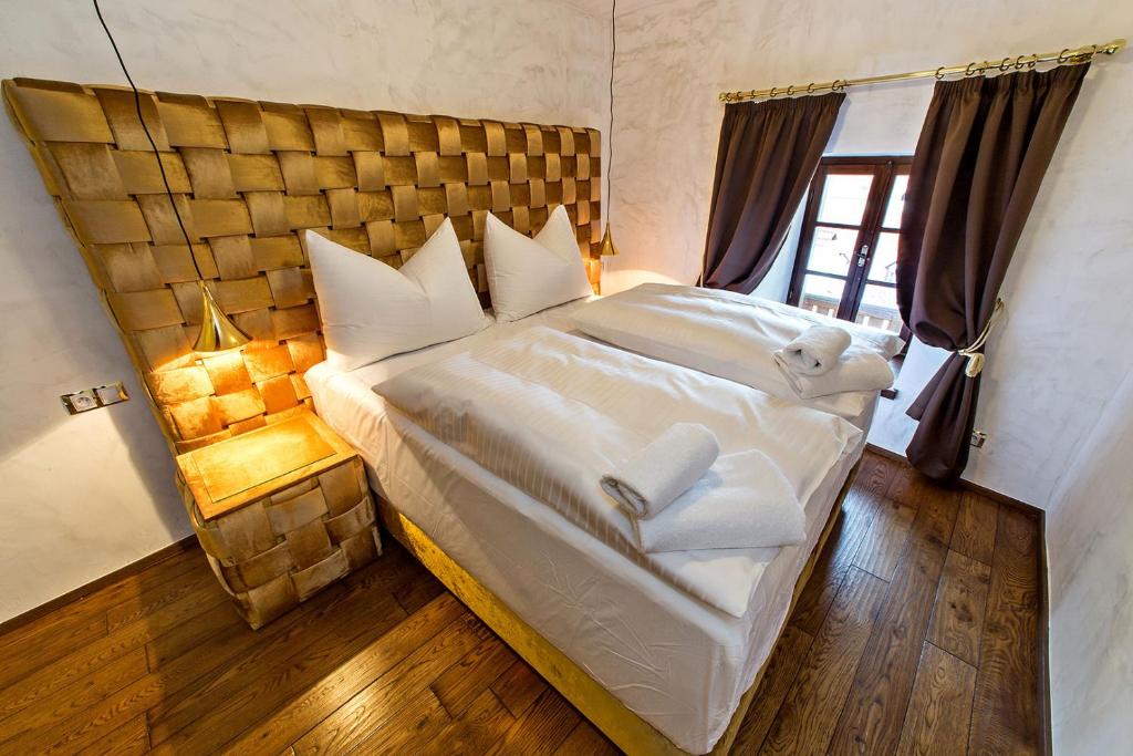 Postel nebo postele na pokoji v ubytování Arcadie Hotel & Apartments