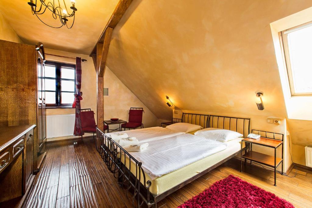Postel nebo postele na pokoji v ubytování Arcadie Hotel & Apartments