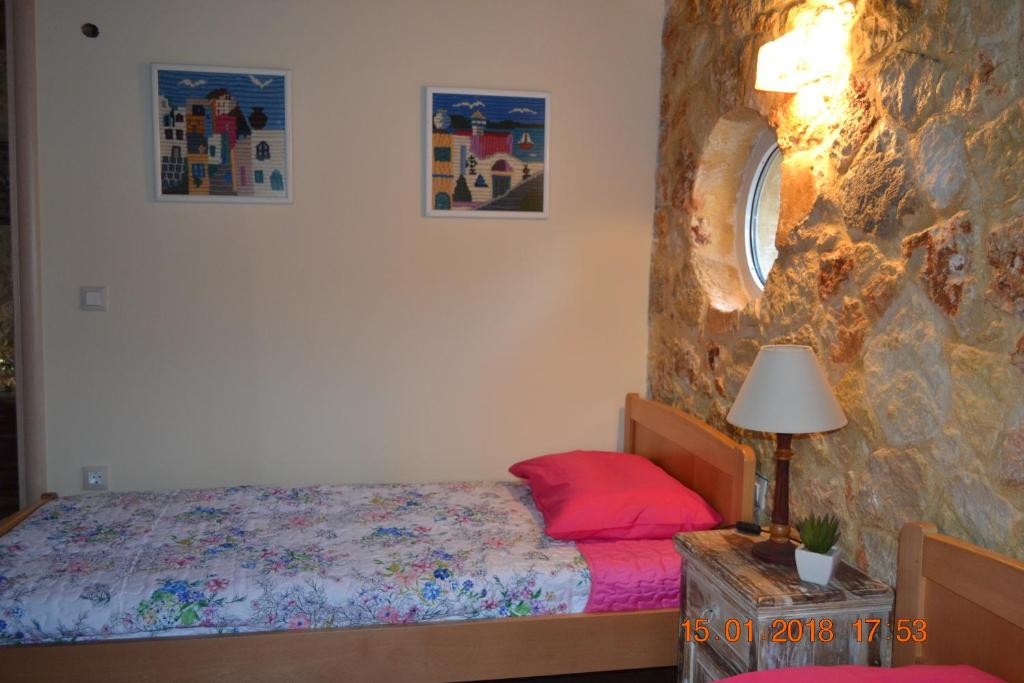 Postel nebo postele na pokoji v ubytování Rumpis Traditional House