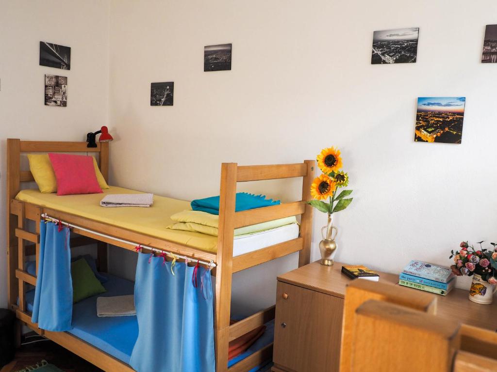 a bedroom with two bunk beds and a desk at Hostel El Diablo in Belgrade