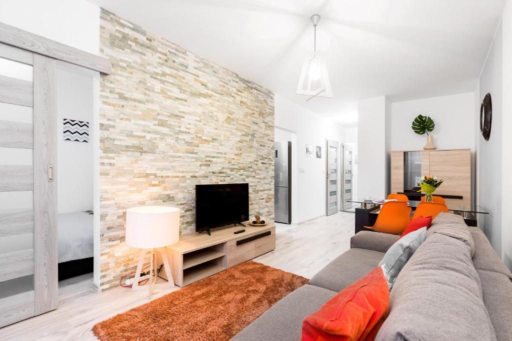 TV a/nebo společenská místnost v ubytování WrocApartments StarCenter - Parking Free