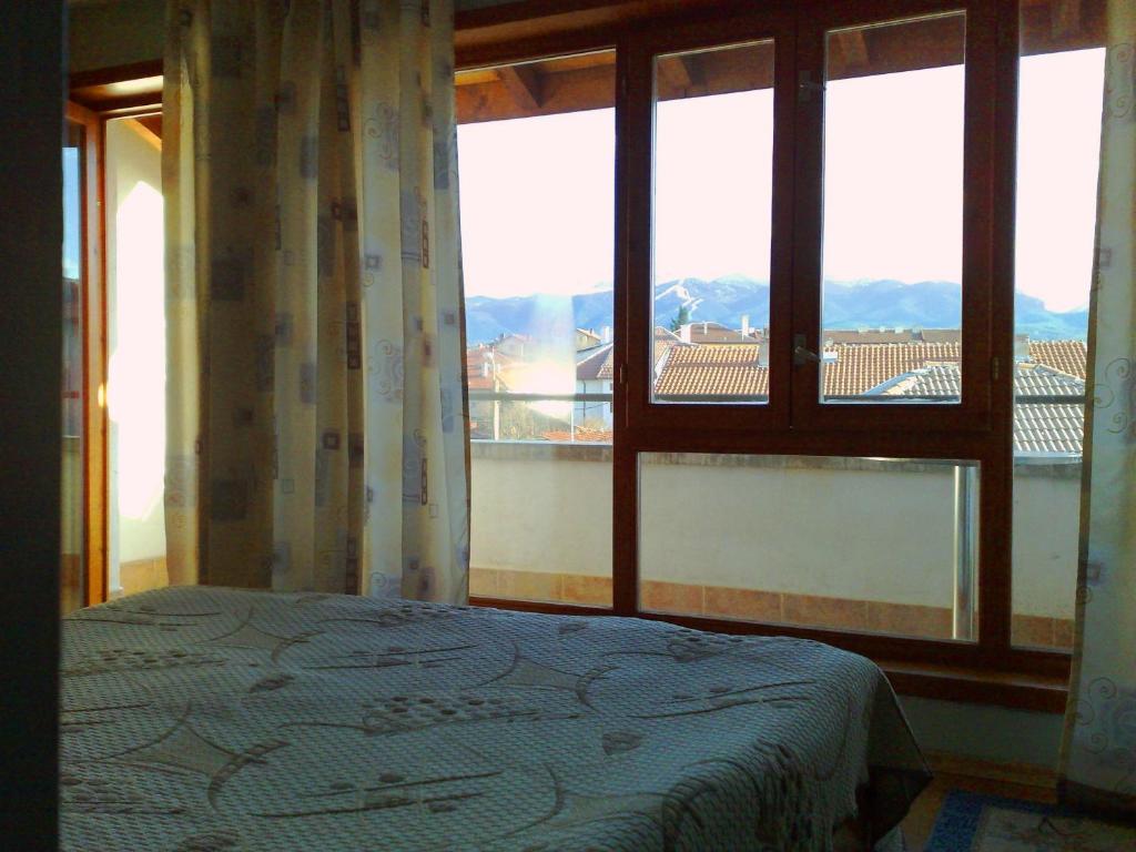 Postel nebo postele na pokoji v ubytování Family Hotel Sonata