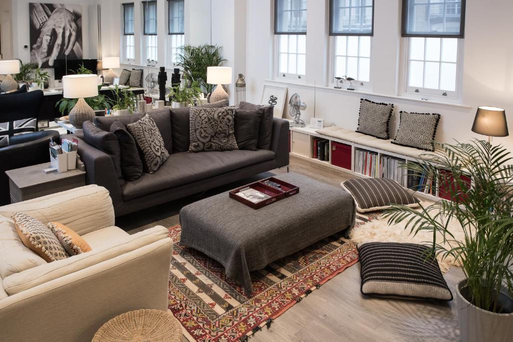 a living room with a couch and a table at 19 Chapel Court in Leamington Spa