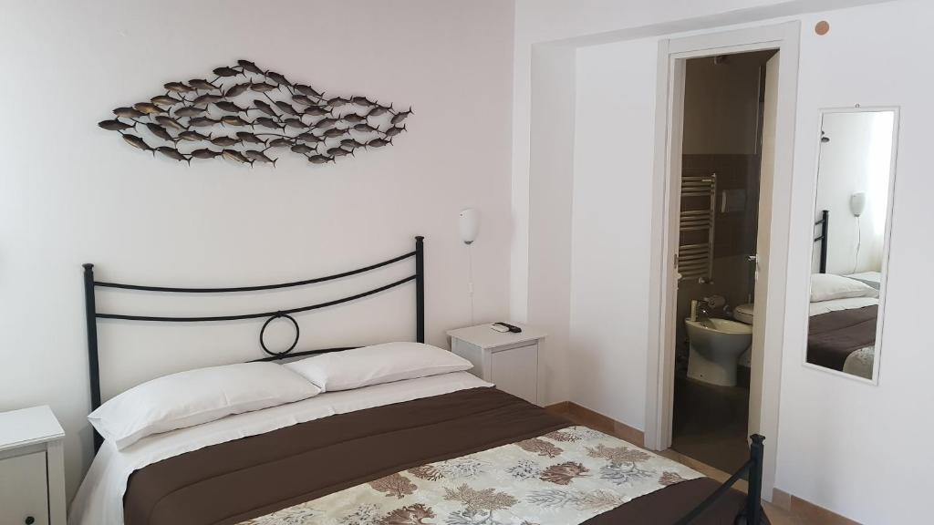 Postel nebo postele na pokoji v ubytování PalermiT'Amo