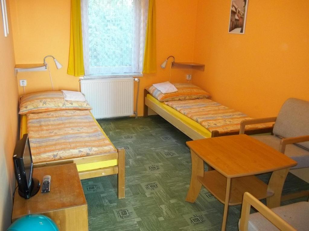 Łóżko lub łóżka w pokoju w obiekcie Pension Dobroucky