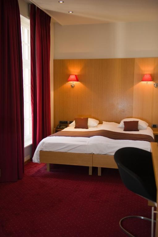 Postel nebo postele na pokoji v ubytování Hotel Bourgoensch Hof