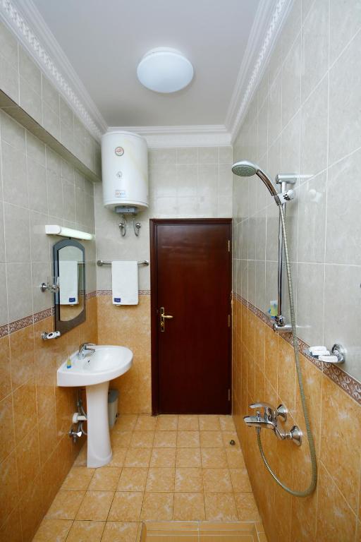 Koupelna v ubytování Muscat International Hotel