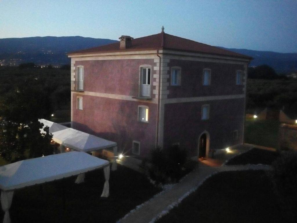 a large building with a table in front of it at Villa Giulia in Lamezia Terme