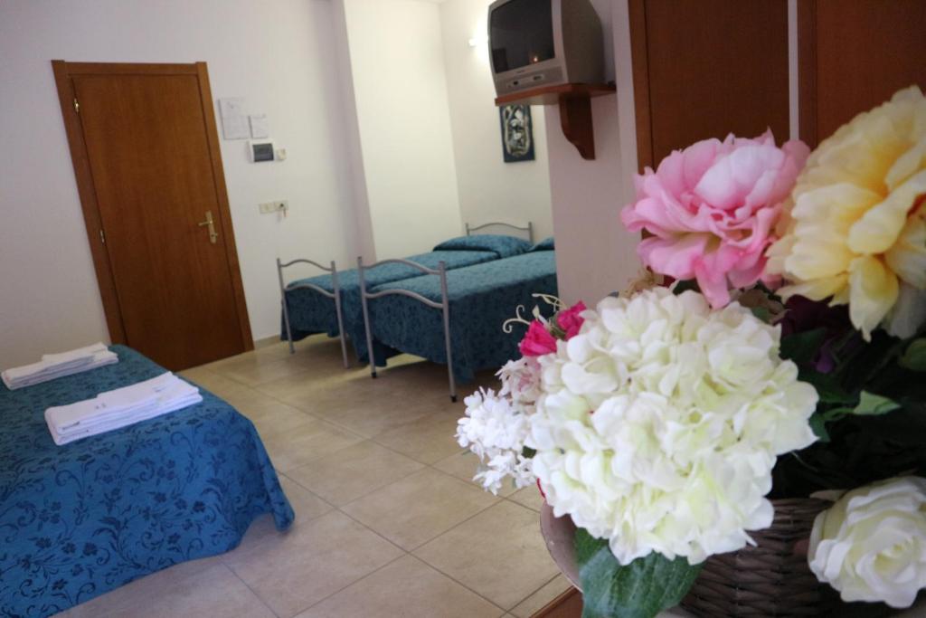 Telewizja i/lub zestaw kina domowego w obiekcie Hotel Orchidea