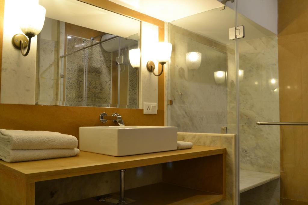 a bathroom with a sink and a mirror at Suryaa Villa - A Boutique Heritage Hotel in Jaipur