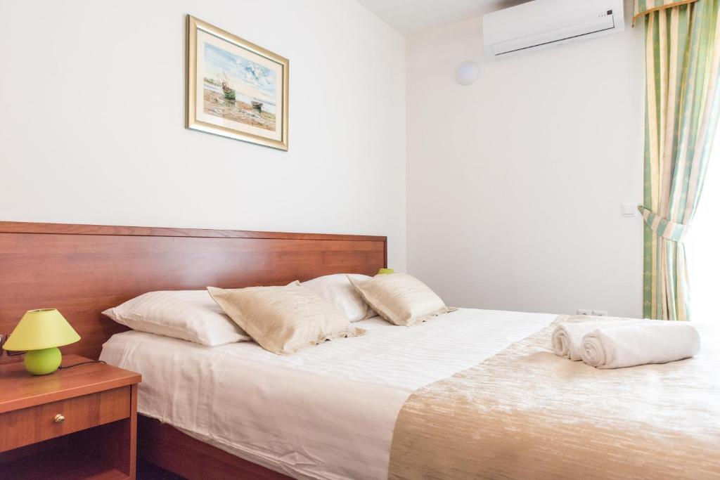 Postel nebo postele na pokoji v ubytování Hotel Krilo