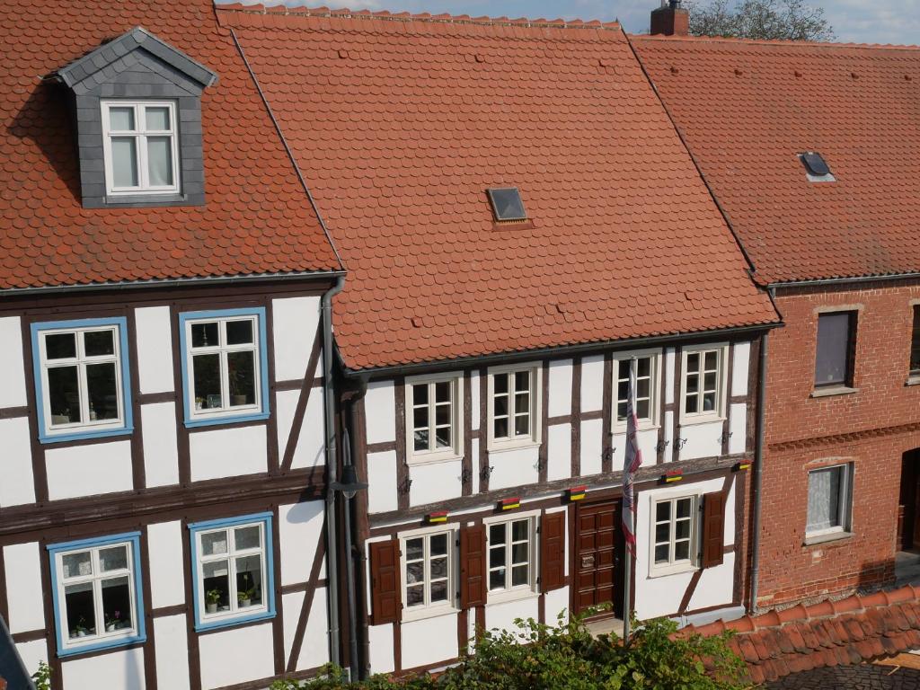 a group of buildings with red roofs at Ferienhaus Marktstraße in Tangermünde